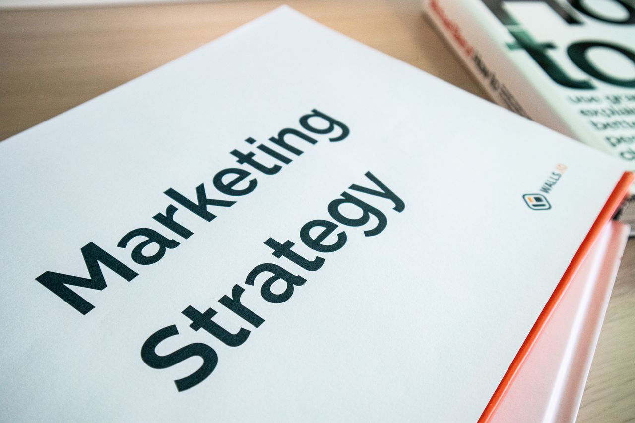 Close-up view of a marketing strategy document placed on a desk, well suited to business content.